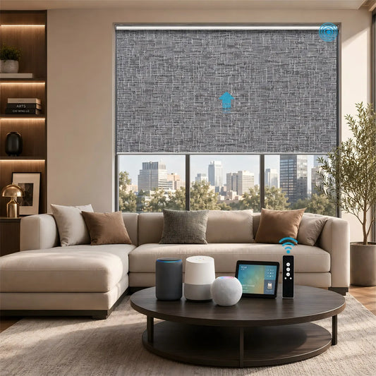 A modern living room with a beige sectional sofa, round dark wood coffee table, and a large window featuring a gray textured roller blind. Smart home devices and a tablet sit on the table, and a city skyline is visible outside the window.