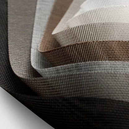 Close-up of woven fabric with brown and gray stripes on a white background