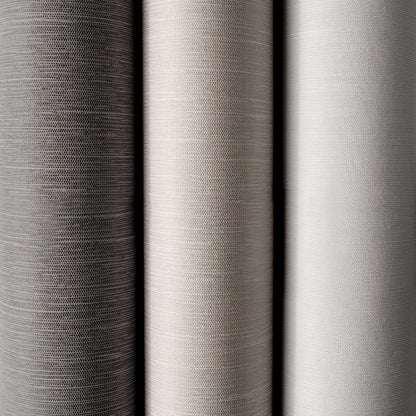 Close-up of three different gray fabric swatches with varying textures.