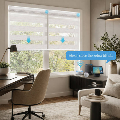 A modern home office scene showing a large window with white zebra roller blinds partially drawn. A blue speech bubble says, 'Alexa, close the zebra blinds.